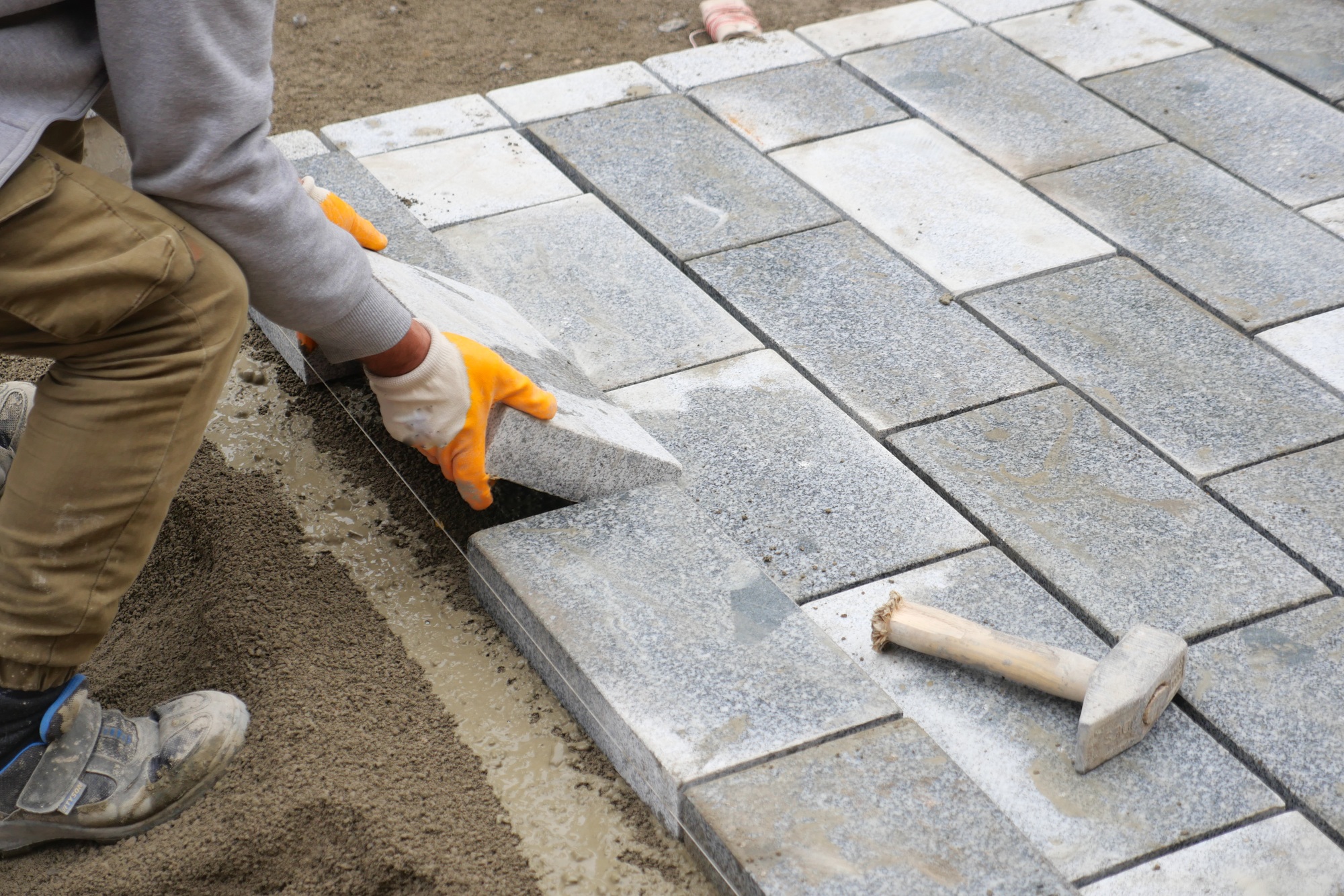 laying concrete bricks on each other for building a new sidewalk in istanbul